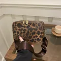Leopard print crossbody camera bag with dual zippers and wide adjustable brown strap - Brown