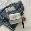 Silver frosted faux leather crossbody bag with cartoon bear print and plush charm accessory - Silver with Charm