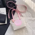 Sac seau en nylon beige clair avec anses roses et bandoulière amovible - Rose