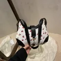 Cute cherry print shoulder bag in white PU leather with black trim and gold hardware - Black