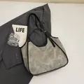 Sac fourre-tout gris texturé avec bordure en cuir noir et bandoulière réglable - Gris