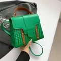 Minimalist green crossbody bag with crocodile pattern and brown leather handle - Green