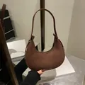 Brown suede half-moon shoulder bag with silver hardware in a minimalist design - Brown