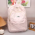 Pink casual backpack with 3D texture and cute rabbit label for a stylish daily look - Pink