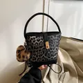 Gray leopard print bucket bag with faux fur texture and black leather handle detail - With Pendant / Black