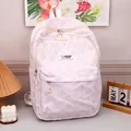 Pink and white textured leisure backpack with cute cartoon rabbit fashion label - Purple