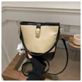 Fashionable apricot and black bucket bag with gold clasp and plush pendant - With Pendant / Black