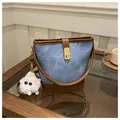 Vintage denim bucket bag with brown leather trim and golden clasp, blue and brown mix - With Pendant / Blue