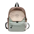 Three-color patchwork student backpack with plush charm and mountain logo on front - Small / Green with Charm