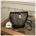 Retro army green canvas bucket bag with black leather trim and cute plush monster charm - With Pendant / Dark Brown