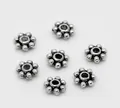 Dettaglio di distanziatori a fiocco di neve in argento antico da 4mm per gioielli fai-da-te - 1000 Pezzi/Confezione (4mm) / Argento Antico