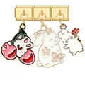 Three gold charm bracelets featuring pink cherry bunny and sakura enamel rabbit pendants - Cherry Rabbit Sakura Gold Combo