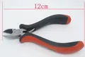 Close-up of 12cm diagonal cutting pliers with ergonomic black and red handles for DIY - 12cm
