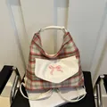 Retro plaid tote bag in red and green with a pink bow and cream leather straps - Pink