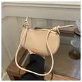 Creamy beige crescent shoulder bag featuring stylish knot detail on the strap - Rose Pink