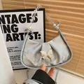 Silver crescent bag with metallic texture, butterfly buckle and pearl chain handle - Silver