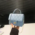 Light blue quilted mini crossbody bag with gold chain and metal twist lock closure - Blue