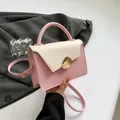 Pink and cream two-tone square PU leather handbag with gold metal clasp and crossbody strap - Pink