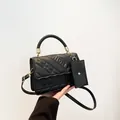 Quilted black leather handbag with FASHION embossing and matching small coin purse charm - Black