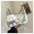 Detail of light green pleated shoulder bag with butterfly charm and fluffy cloud pendant - Green with Pendant
