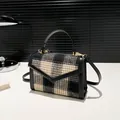 Classic black and khaki tweed crossbody bag with golden hardware and leather top handle - Black