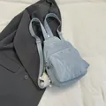 Light blue crinkled fabric chest bag with triple zippers and cute plush monster charm - With Pendant / Blue