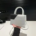 Minimalist black and white faux leather crossbody bag with mixed crocodile textures - White