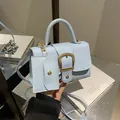 Minimalist light blue mini handbag with golden buckle and matching small coin purse - Blue