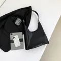 Minimalist black matte hobo bag featuring HIS HIS letter embossing and chain strap detail - Black
