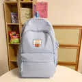 Sac à dos minimaliste en nylon bleu-violet clair avec patch smiley pour étudiants - Bleu