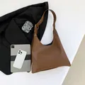 Brown leather hobo shoulder bag with embossed letters and adjustable strap for women - Brown