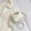 White ruched crossbody pillow bag with wide handle and soft leather texture - White