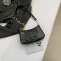 Retro black patent leather underarm bag with butterfly embossing and gold chain strap - Black
