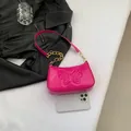 Glossy magenta butterfly relief underarm bag with decorative gold chunky chain strap - Rose Red