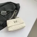 Beige quilted chain square bag with silver bow accent and leather woven shoulder strap - White