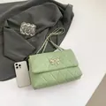 Light green quilted chain bag with golden bow buckle and leather-woven strap - Green