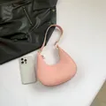 Minimalist light pink crescent hobo bag for women with golden zipper and sleek finish - Pink