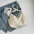 Minimalist beige canvas crossbody bag with adjustable strap and side pockets for women - Off White