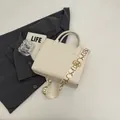 Creamy beige leather tote bag with a patterned wide shoulder strap in minimalist style - Off White