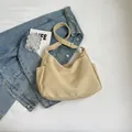 Minimalist beige canvas hobo bag with side pockets and adjustable wide shoulder strap - Khaki