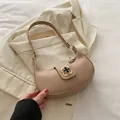 Elegant khaki crescent shoulder bag with a vintage gold floral buckle for daily commute - Khaki