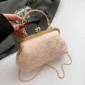 Pink floral jacquard frame bag with golden flower handle and chain strap for women - Pink