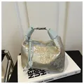 Silver brocade shoulder bag with traditional landscape patterns and blue leather handle - Blue