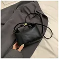 Chic black crossbody square bag with Rich Rabbit embossed pattern and gold buckle - Black