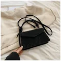 Elegant black velvet handbag with knotted handle and gold metal hardware for women - Black
