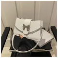 Chic white rectangular shoulder bag with silver bow buckle and chain detail - White