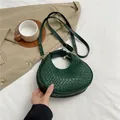 Dark green woven crescent handbag in premium PU leather featuring a classic braided pattern - Green