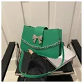 Vibrant green PU leather crossbody bag with silver bow ornament and chain detail - Dark Green