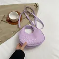 Chic lavender woven leather crescent handbag with adjustable crossbody shoulder strap - Purple