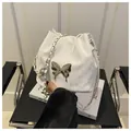 Chic white drawstring bucket bag with silver butterfly emblem and metal chain strap - White Without Pendant